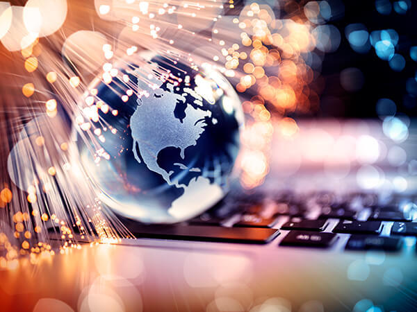 Lighted up globe above a keyboard