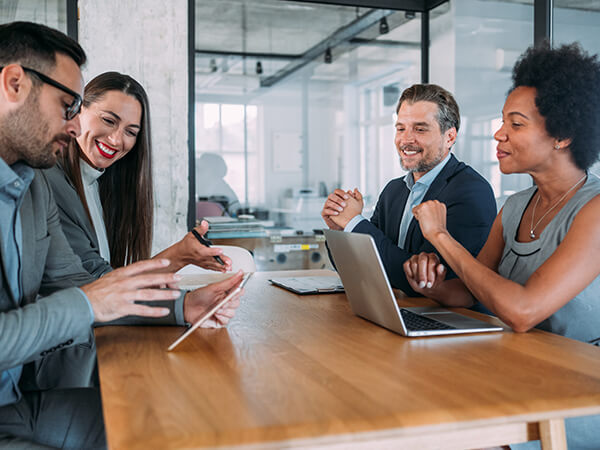 Partners Network Advantage Features 600x450 People in conference room collaborating