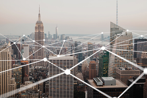 Business Business Cloud Access Sub Hero 600x400 White dots with connected lines above a city skyline