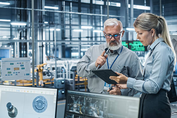 Business Manufacturing Sub Hero 600x400 Manufacturing area with two people looking at a tablet computer