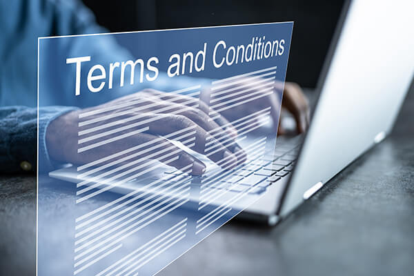 3-D of Terms and Conditions coming from computer screen