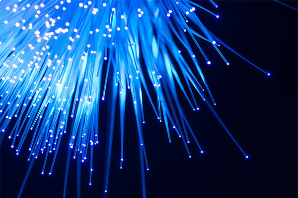 Ray of blue fiber strand lights all in a cluster