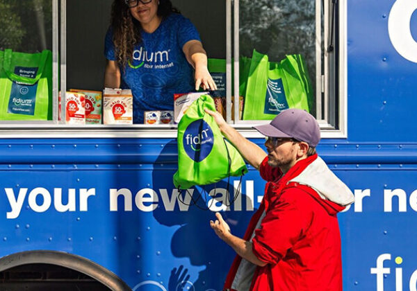 About Us Fidium Blue Truck Sub Hero 600x400 Fidium food truck handing out goodies