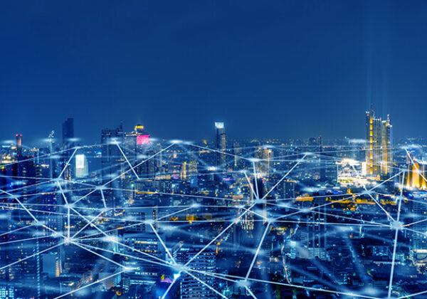 City sky view with grid of lights and dots across the city