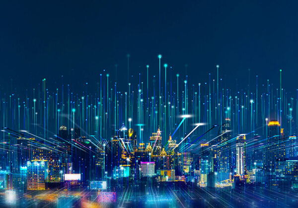 Large city view with rays of light shooting towards the sky