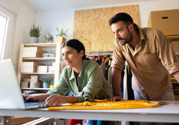 Woman and man looking at computer screen in retail shop