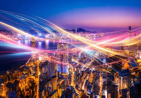 City sky view with multiple color lights running in the sky