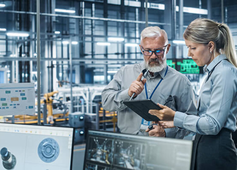 Business Manufacturing Sub Hero 600x400 Manufacturing area with two people looking at a tablet computer