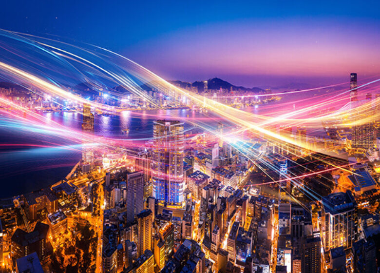 City sky view with multiple color lights running in the sky