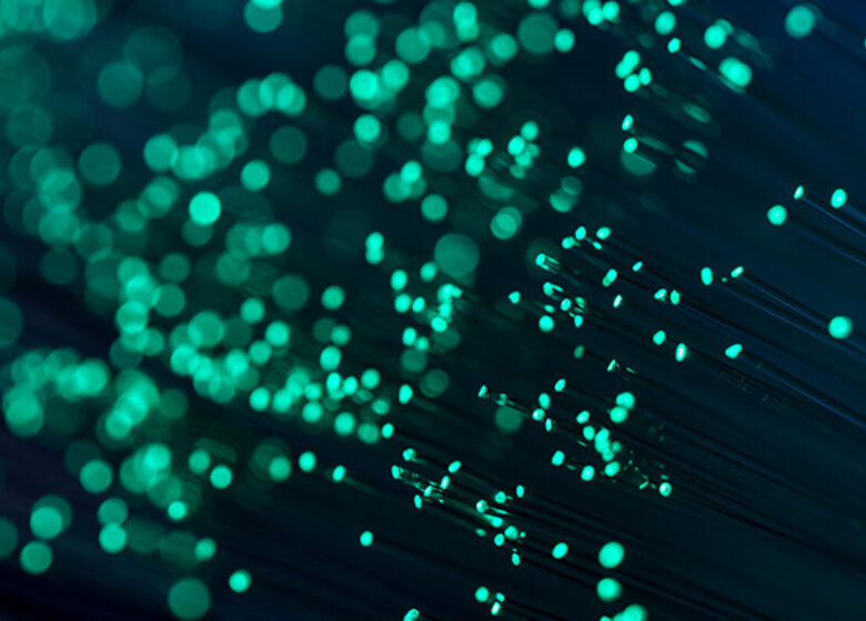 Wholesale Dark Fiber Hero 600x400 Bright green lit up strands of light