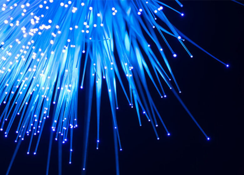 Ray of blue fiber strand lights all in a cluster