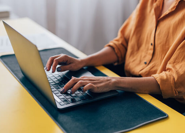 Wholesale Trouble Administration Sub Hero 600x400 Woman typing on laptop